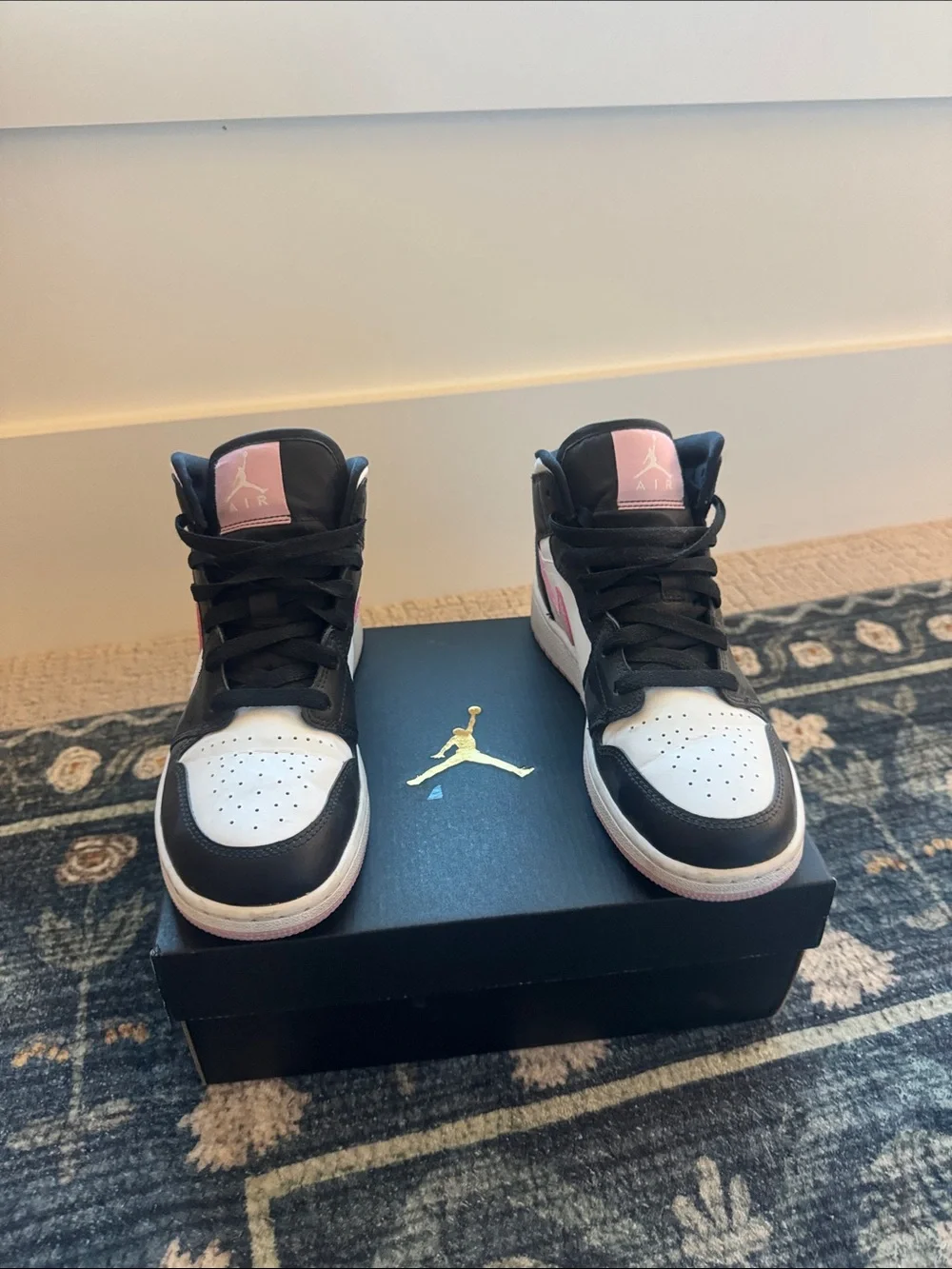 Nike Air Jordan 1 Mid High-Top Sneakers in Black, White & Pink